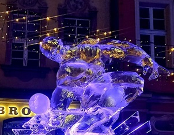 The photo shows an athlete with a ball. The sculpture took 3rd place.